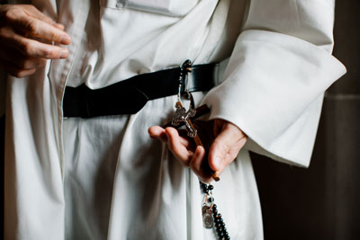 Friar holding a rosary