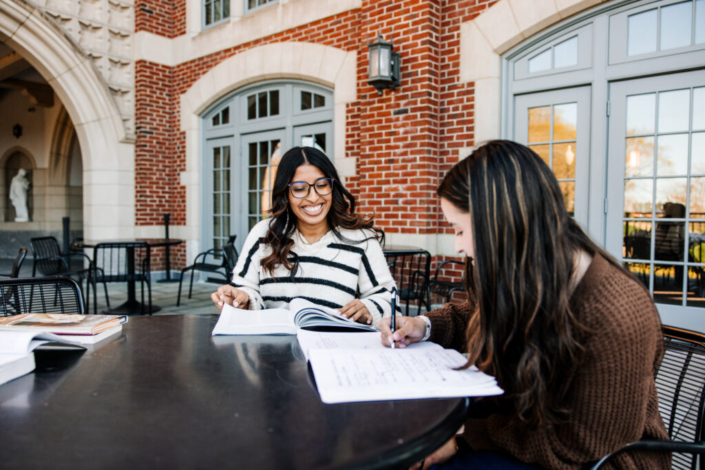 Outdoor photo of students studying.